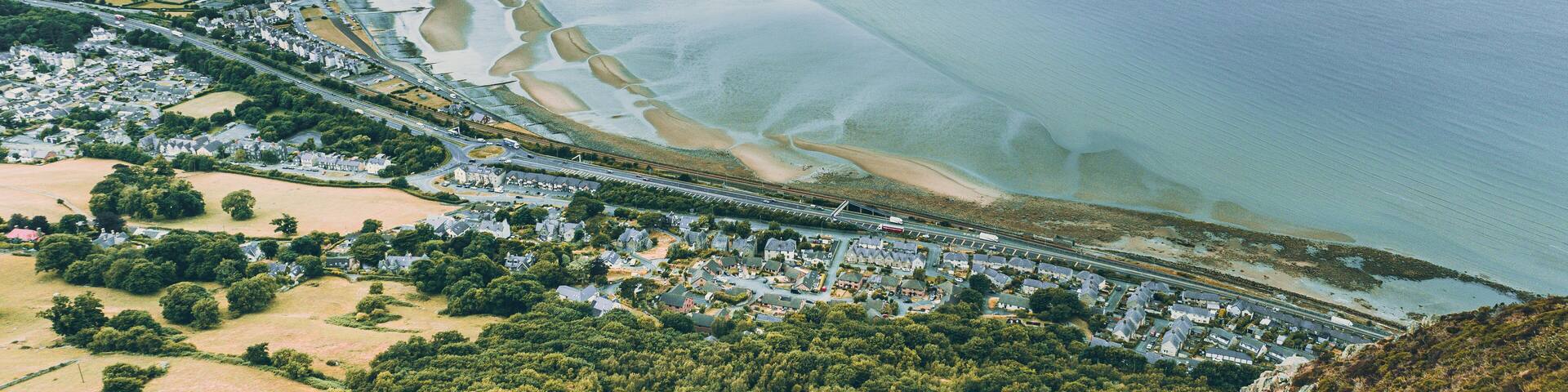 Aerial view of a little town surrounded by beautiful nature Llanfairfechan, North Wales, Cymru, UK