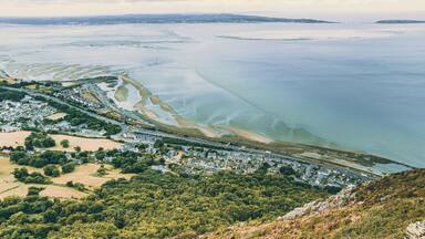 Aerial view of a little town surrounded by beautiful nature Llanfairfechan, North Wales, Cymru, UK