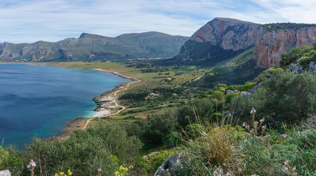 Panoramic view over mediterranean coastline with bay of sea water at Nature Park Monte Cofano with green vegetation, San Vito Lo Capo, Sicily, Italy