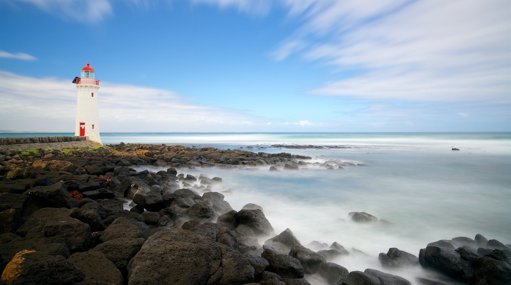 Griffiths Island Lighthouse featuring a bay or harbour, rugged coastline and a lighthouse