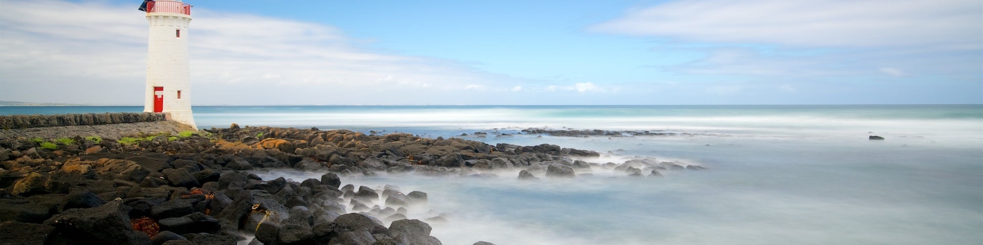 Griffiths Island Lighthouse showing a bay or harbour, rugged coastline and a lighthouse