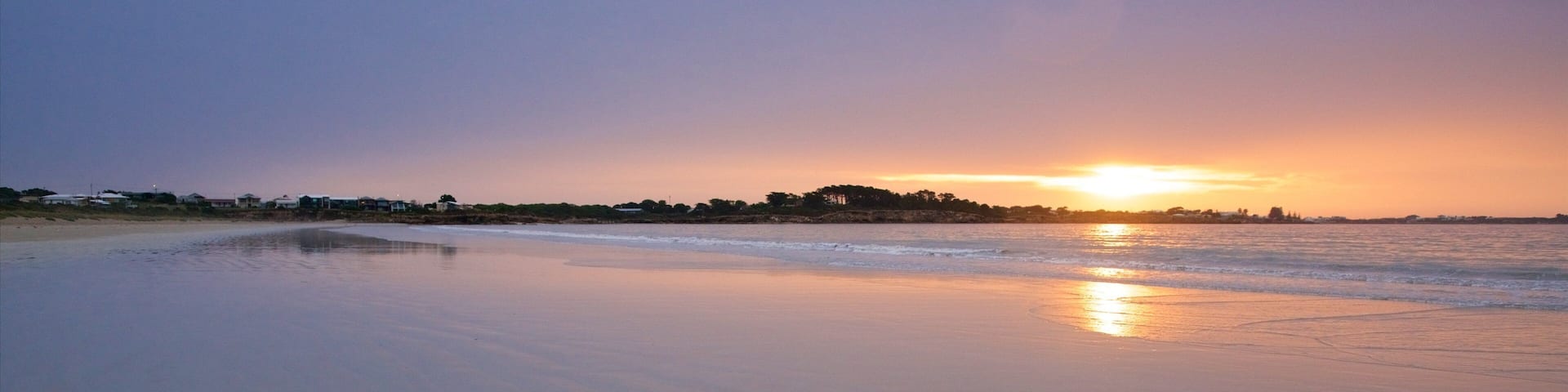 Long Beach featuring a sandy beach, general coastal views and a sunset