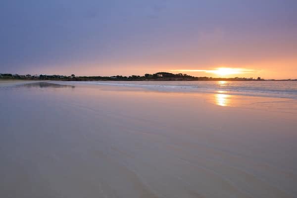 Long Beach featuring a sandy beach, general coastal views and a sunset