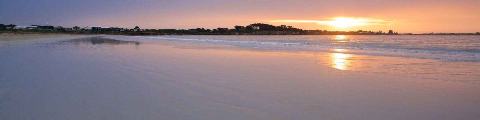 Long Beach featuring a sandy beach, general coastal views and a sunset