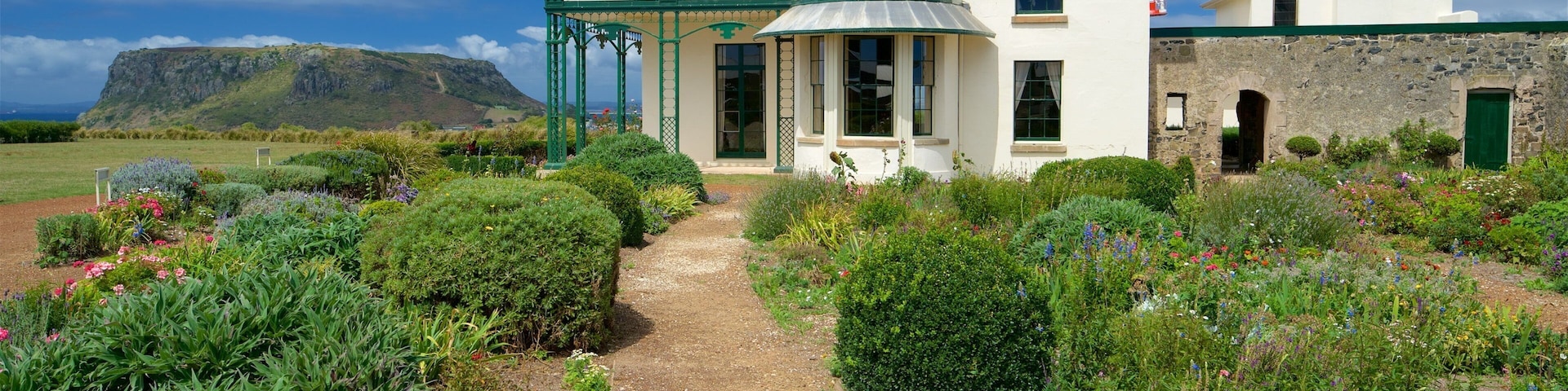 Highfield Histroric Site featuring mountains, flowers and a garden