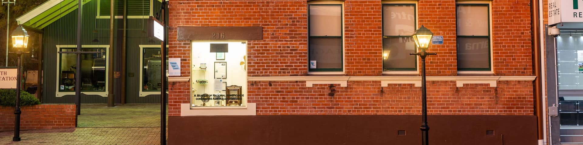 A red brick building with a sign reading "Tamworth Municipal Electric Showroom."