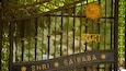 A gate with the inscription "Shri Sai Baba" and a sun symbol.