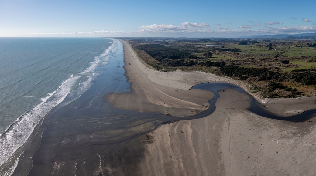 A panoramic aerial shot from Ōtaki Beach, on the Kapiti Coast of New Zealand, looking North with the Mouth of the Waitohu stream as it meets the Tasman Sea