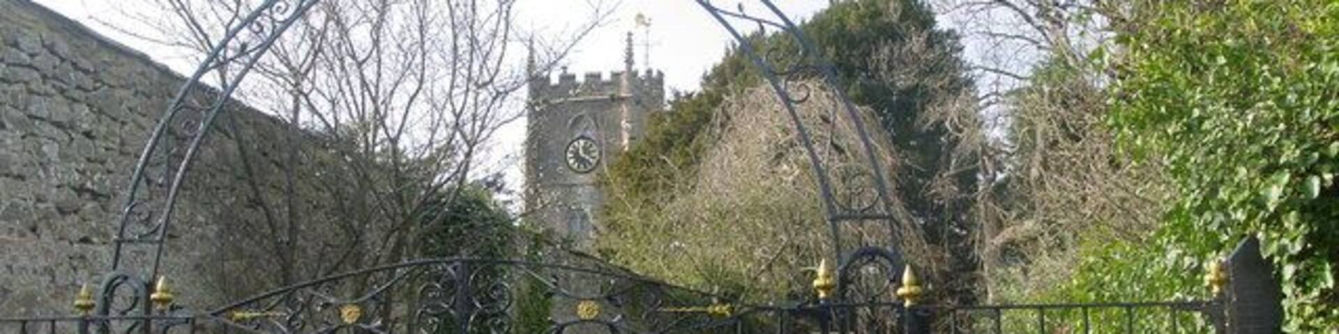 St Nicholas church, Brockley The wrought iron gates open to the footpath to the churchyard proper. The church is now redundant.