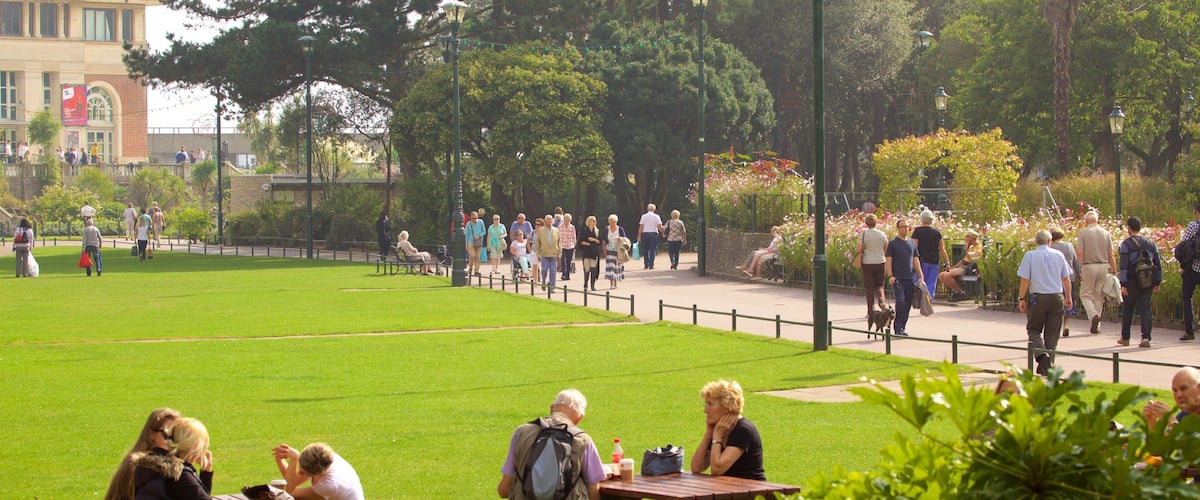 Bournemouth Lower Gardens featuring hiking or walking and a park as well as a couple