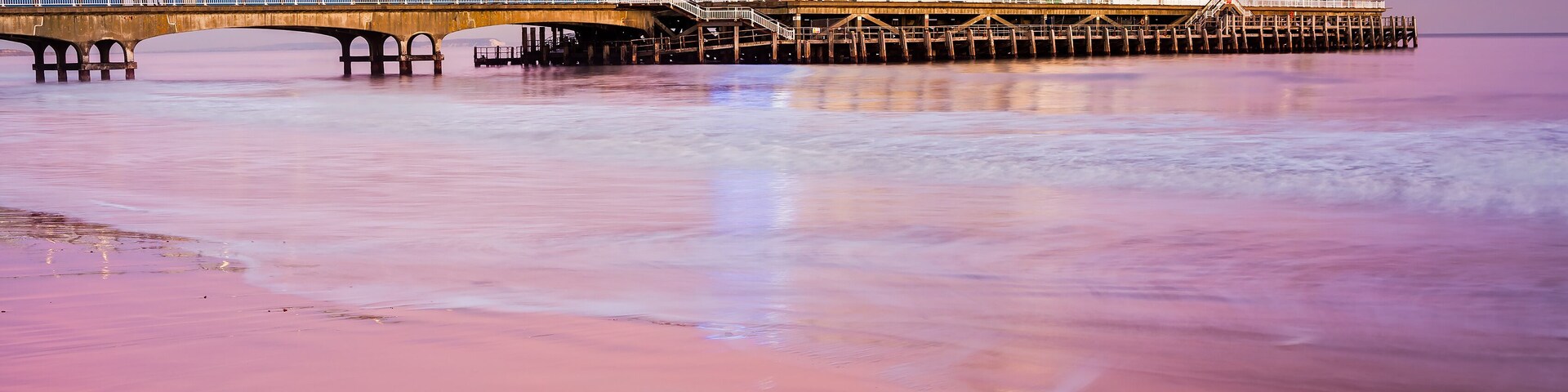Bournemouth pier at Sunset from the beach Dorset England UK Europe