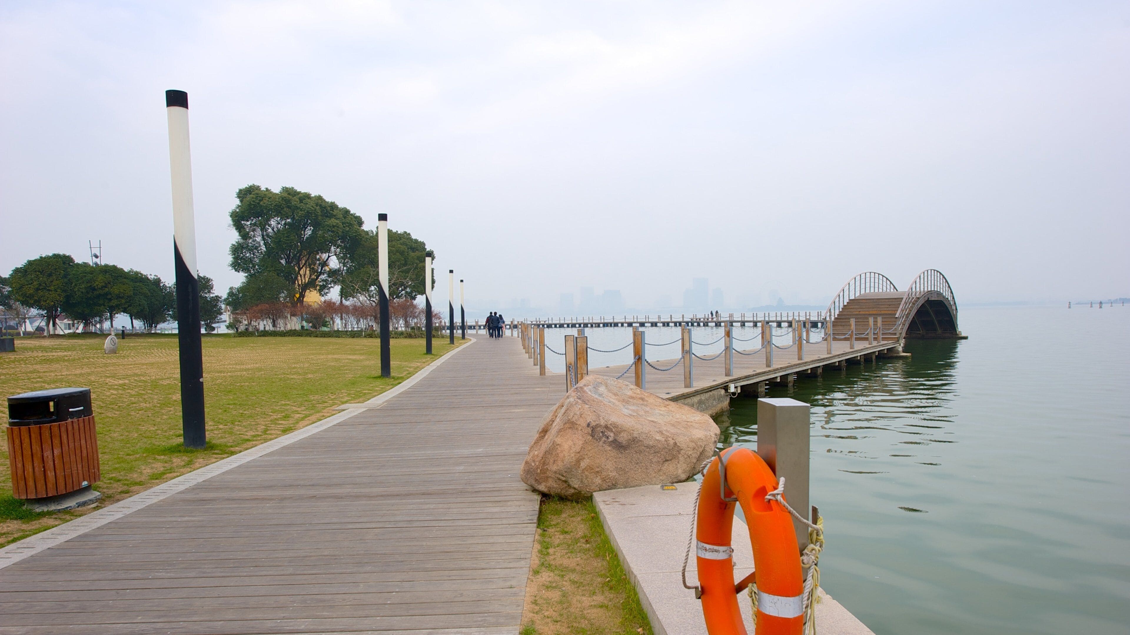 Jinji Lake featuring a lake or waterhole and a bridge