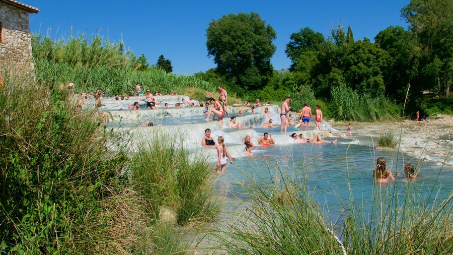 Grosseto showing swimming and a hot spring as well as a large group of people