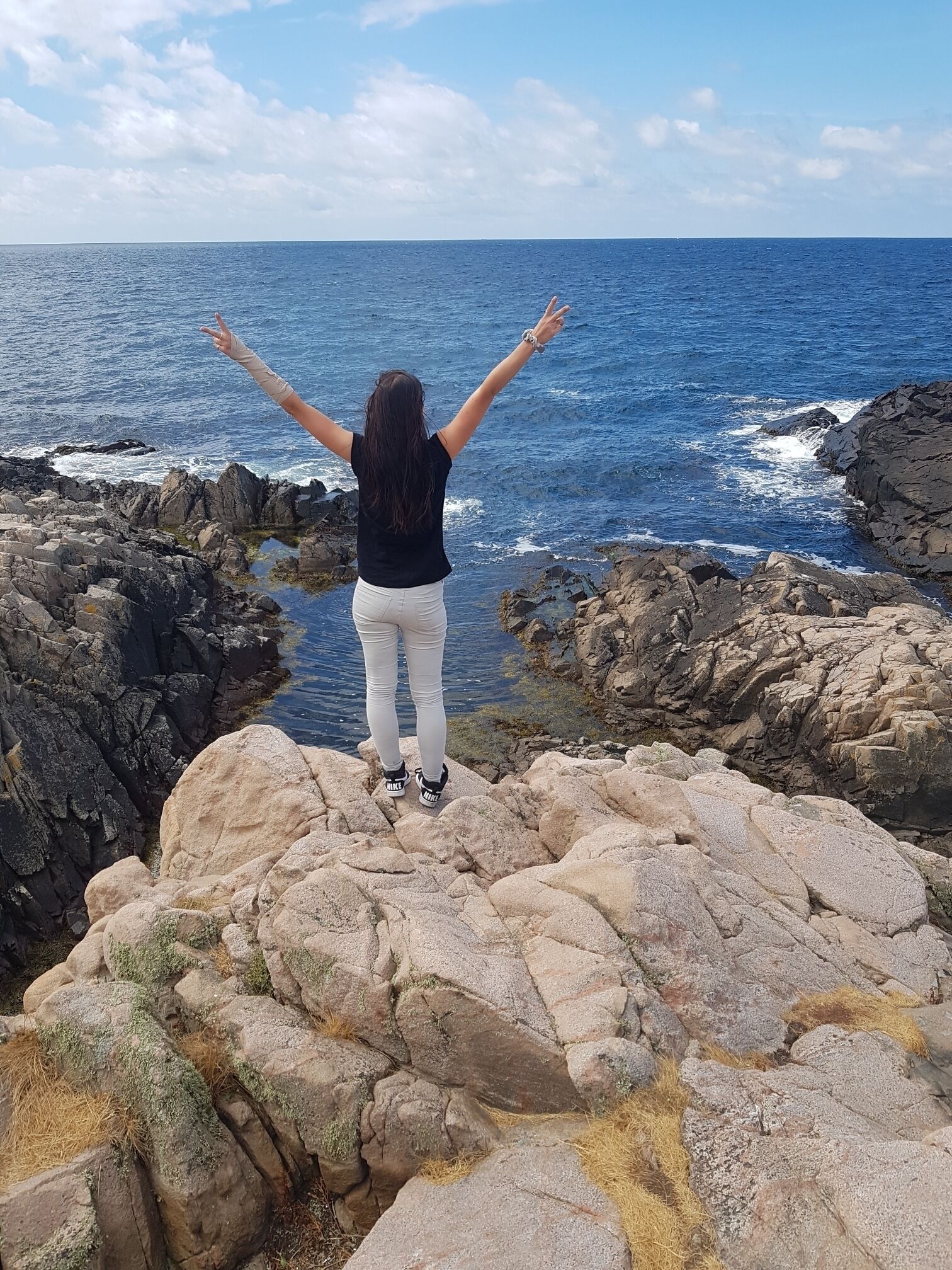 This is in Sweden, a place called Kullaberg right outside of Helsingborg. Here you can hike and climb on the cliffs by the ocean. It's very exciting, beautiful but dangerous. Once down, you can have a swim.. where's safe. It doesn't cost anything!