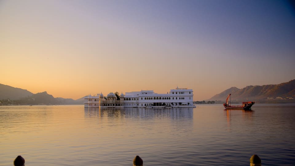 Lake Palace showing a sunset, boating and a lake or waterhole