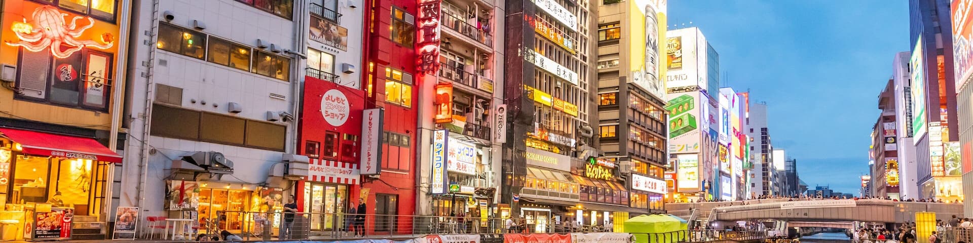 Dotonbori which includes boating, a city and a river or creek