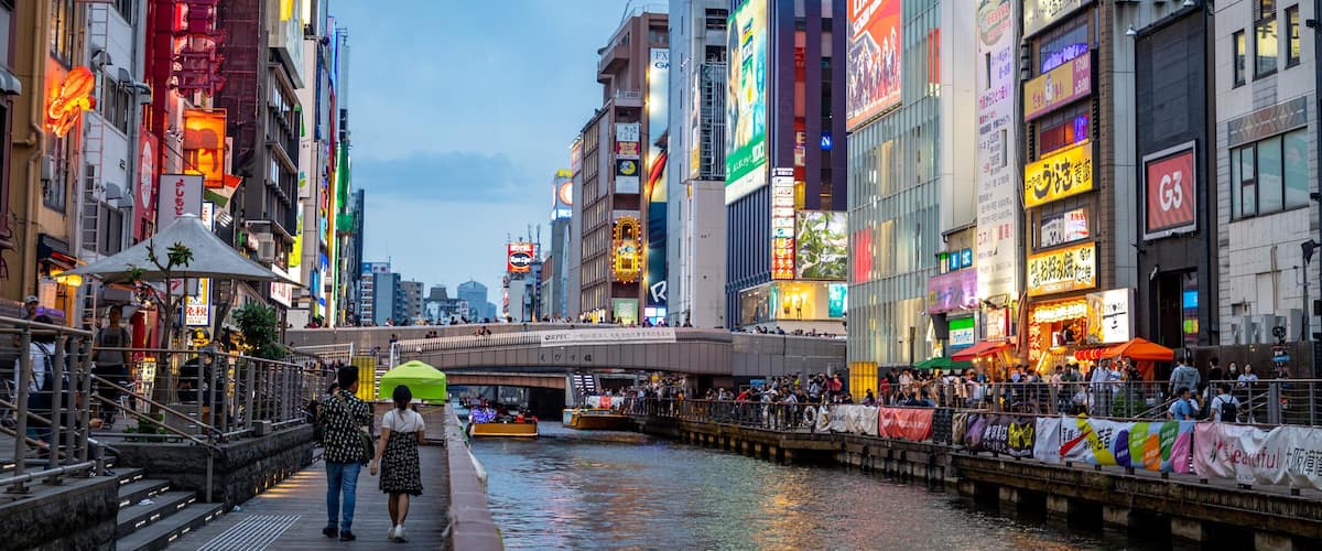 Dotonbori showing city views, a river or creek and a city