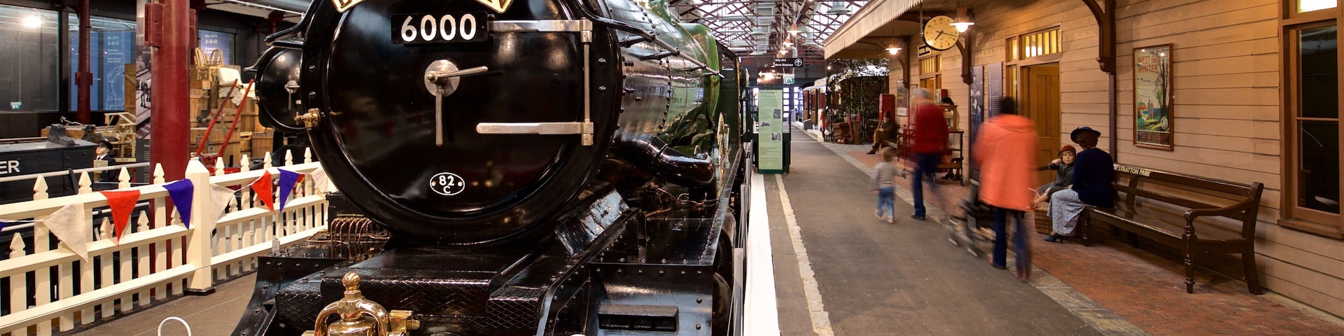 A steam locomotive named "The Bristolian" with the number 6000 at a train station.