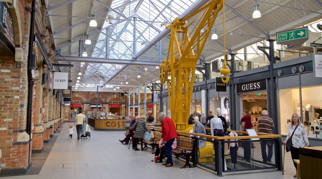 Swindon Designer Outlet which includes shopping and interior views as well as a small group of people