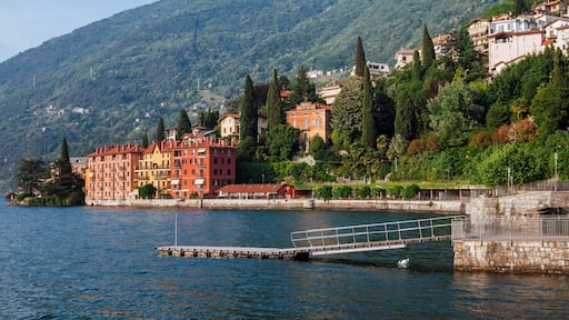 Coastline of Bellano fishing village, situated on Como Lake shore, Lombardy, Italy. Traditional italian houses, mountains and pier in small coast town Bellano.