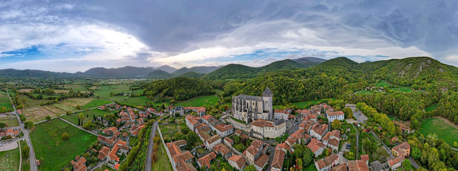 Aerial fly over above Saint-Bertrand-de-Comminges one of the Plus Beaux Villages in the French side of the Pyrenees mountains