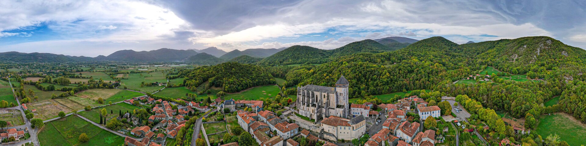 Aerial fly over above Saint-Bertrand-de-Comminges one of the Plus Beaux Villages in the French side of the Pyrenees mountains