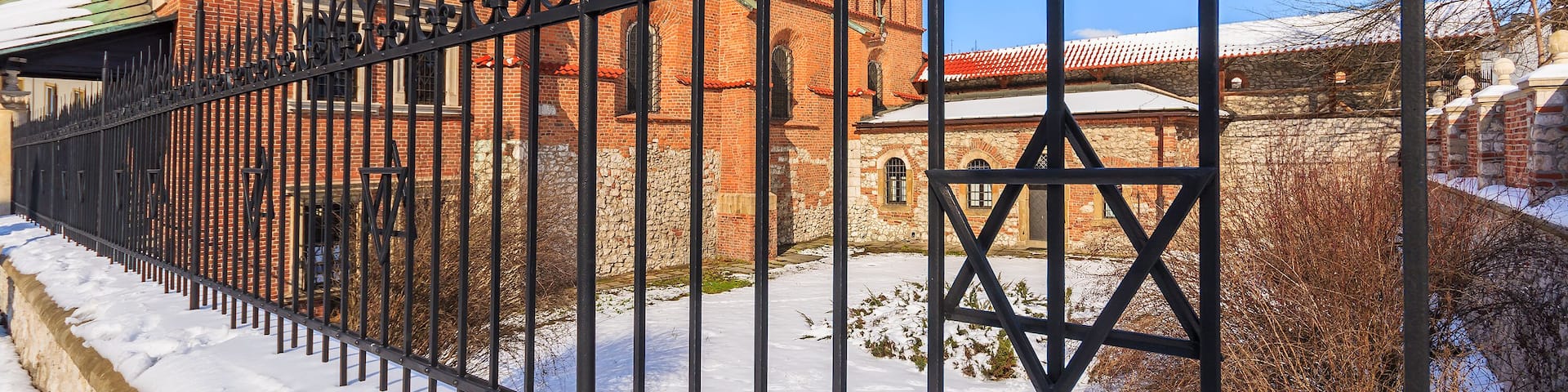 David star on fence of old Jewish synagogue in Kazimierz district of Krakow city, Poland; Shutterstock ID 242821396