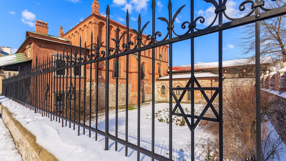 David star on fence of old Jewish synagogue in Kazimierz district of Krakow city, Poland; Shutterstock ID 242821396
