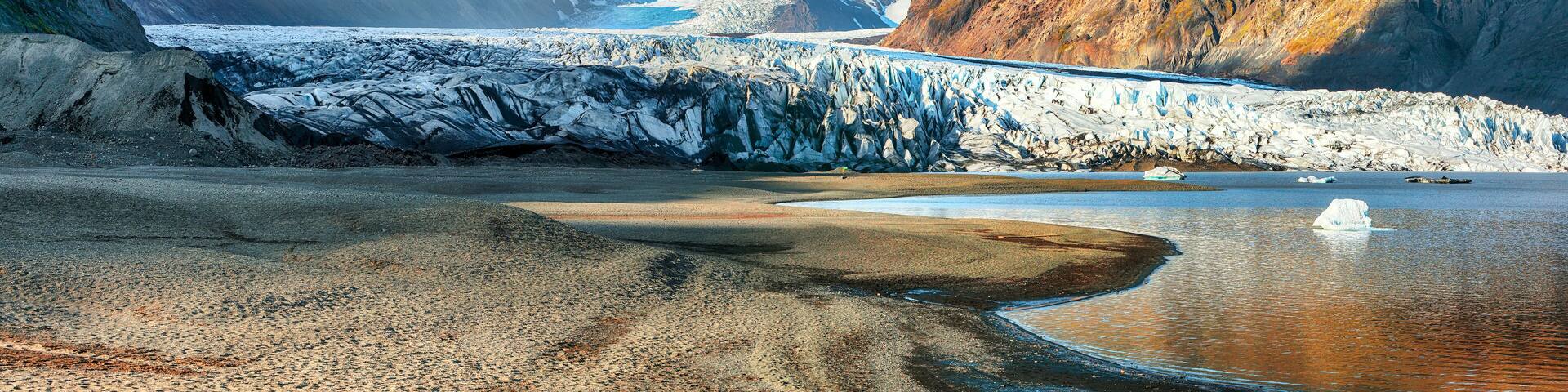 Breathtaking view of Skaftafellsjokull glacier tongue and volcanic mountains around on South Iceland.