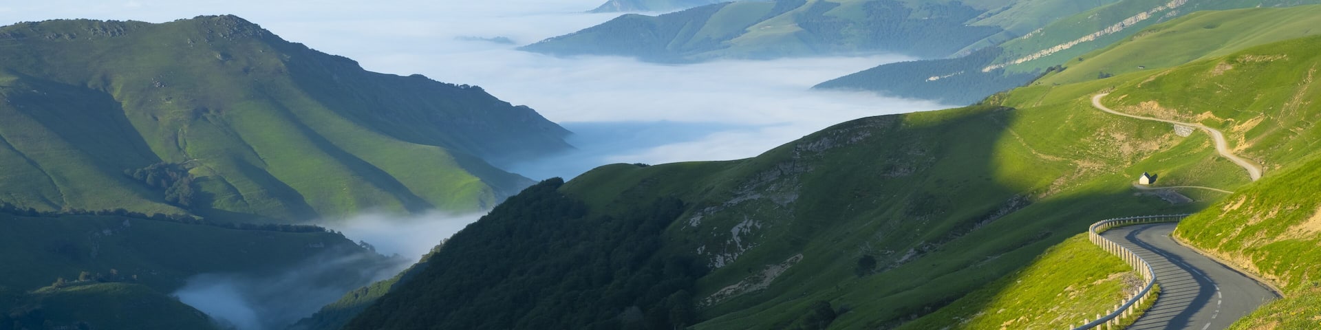 mountain road with sea of clouds in the pass of Larrau, Pyrenees of France
