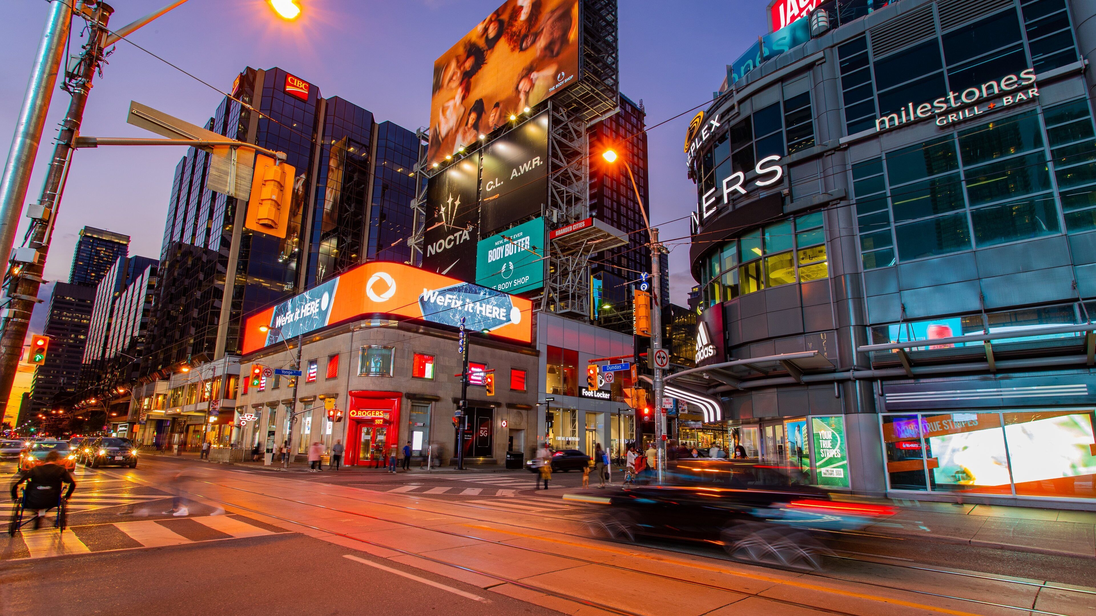 Yonge-Dundas Square featuring signage, night scenes and a city