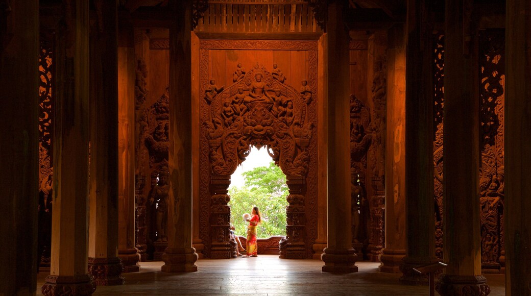 Sanctuary of Truth showing a temple or place of worship and interior views as well as an individual femail