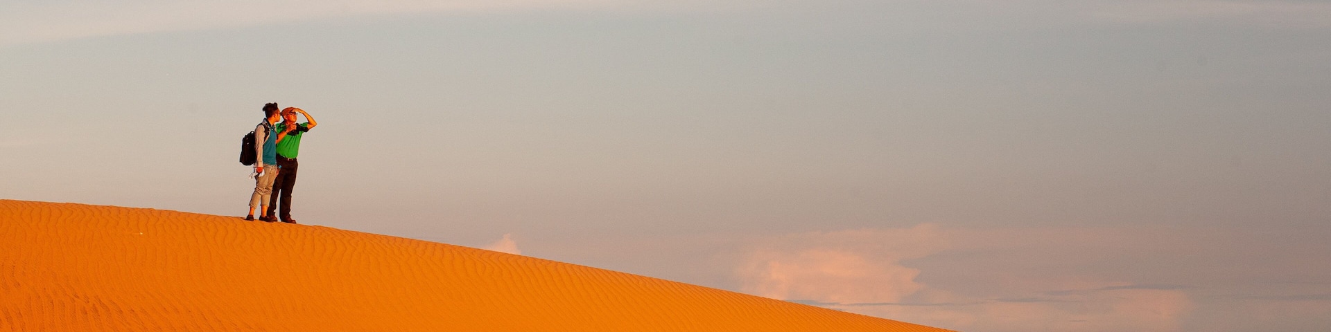 Mui Ne Sand Dunes which includes a sandy beach as well as a couple