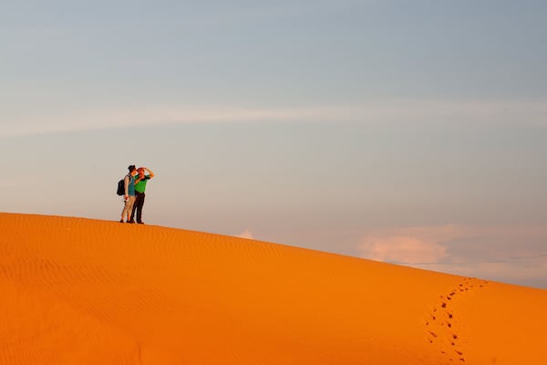 Mui Ne Sand Dunes which includes a sandy beach as well as a couple