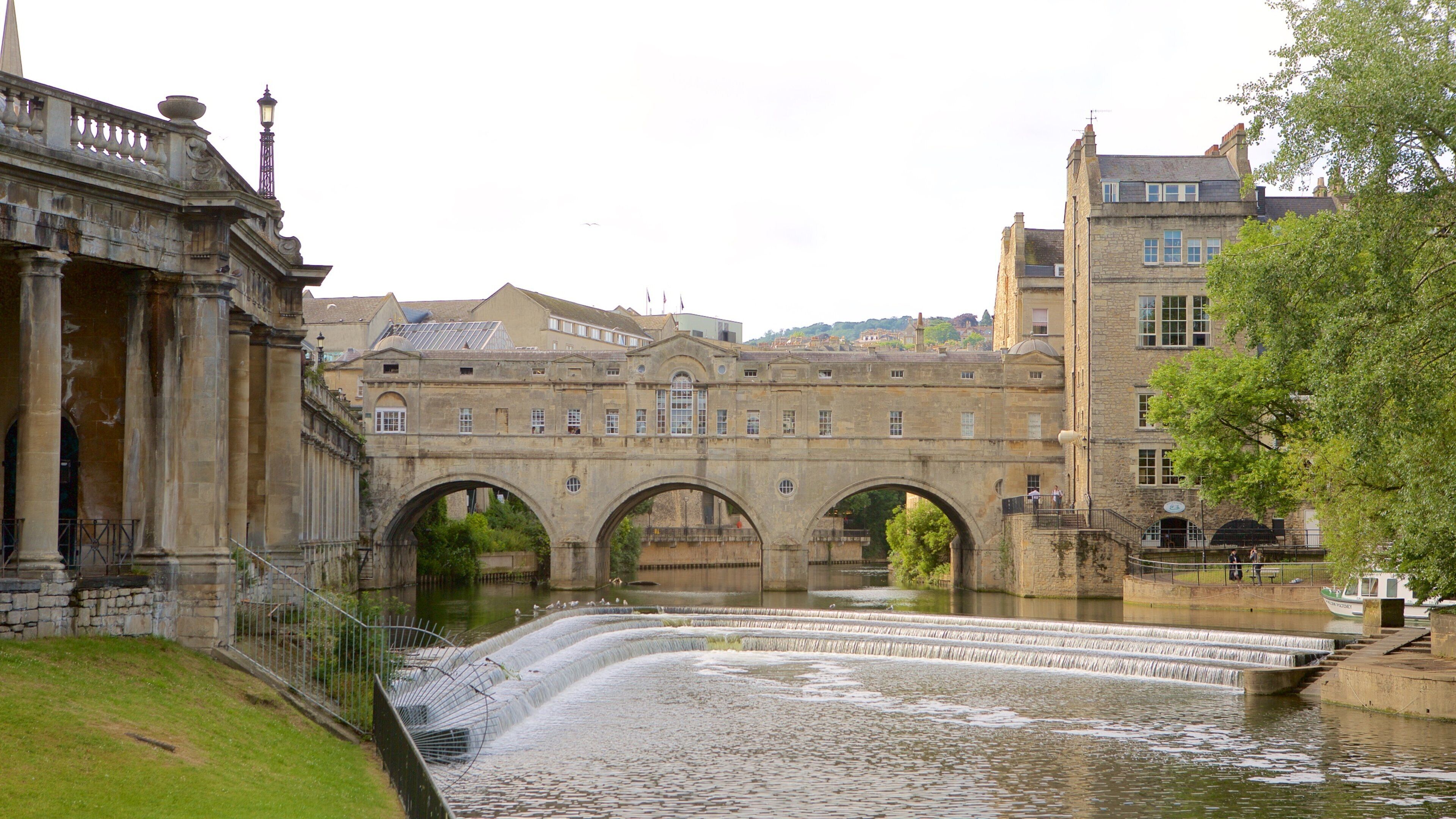 Pulteney Bridge showing heritage architecture, an administrative building and a city