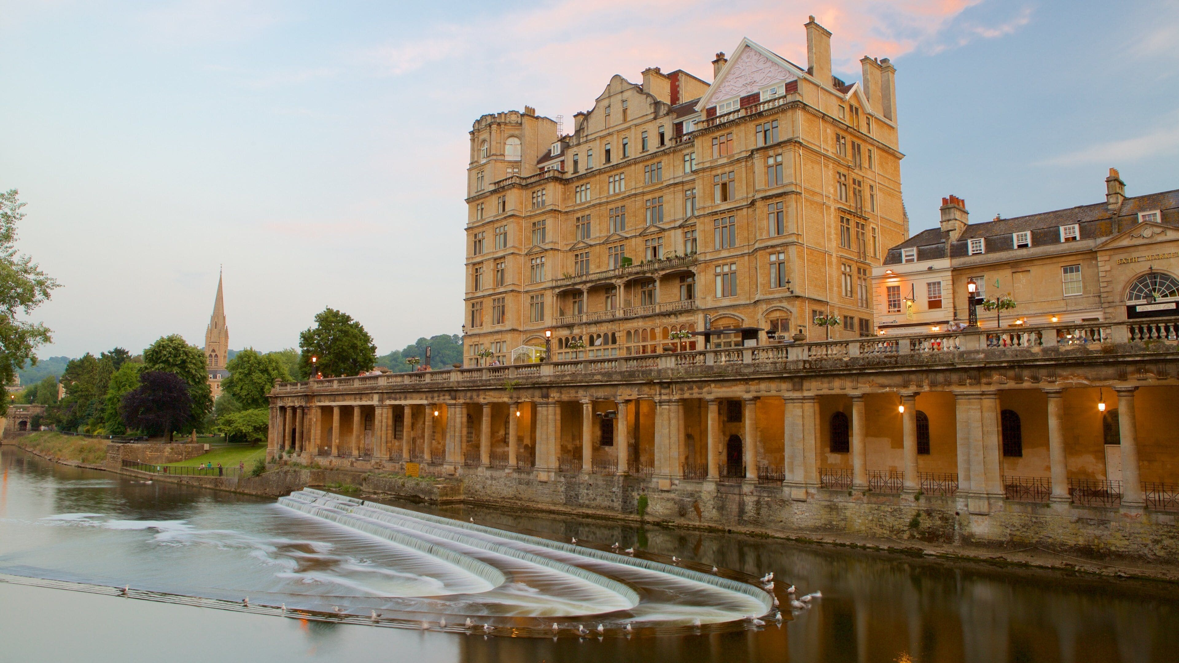 A historic building with a river in front.