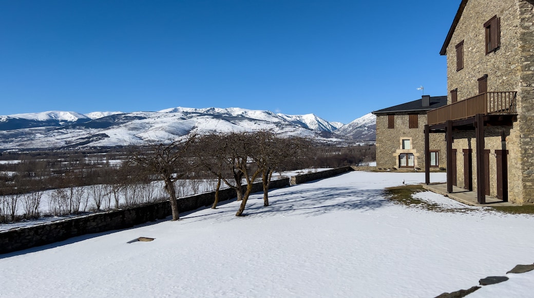 Stone buildings with snow capped mountains in Catalonia