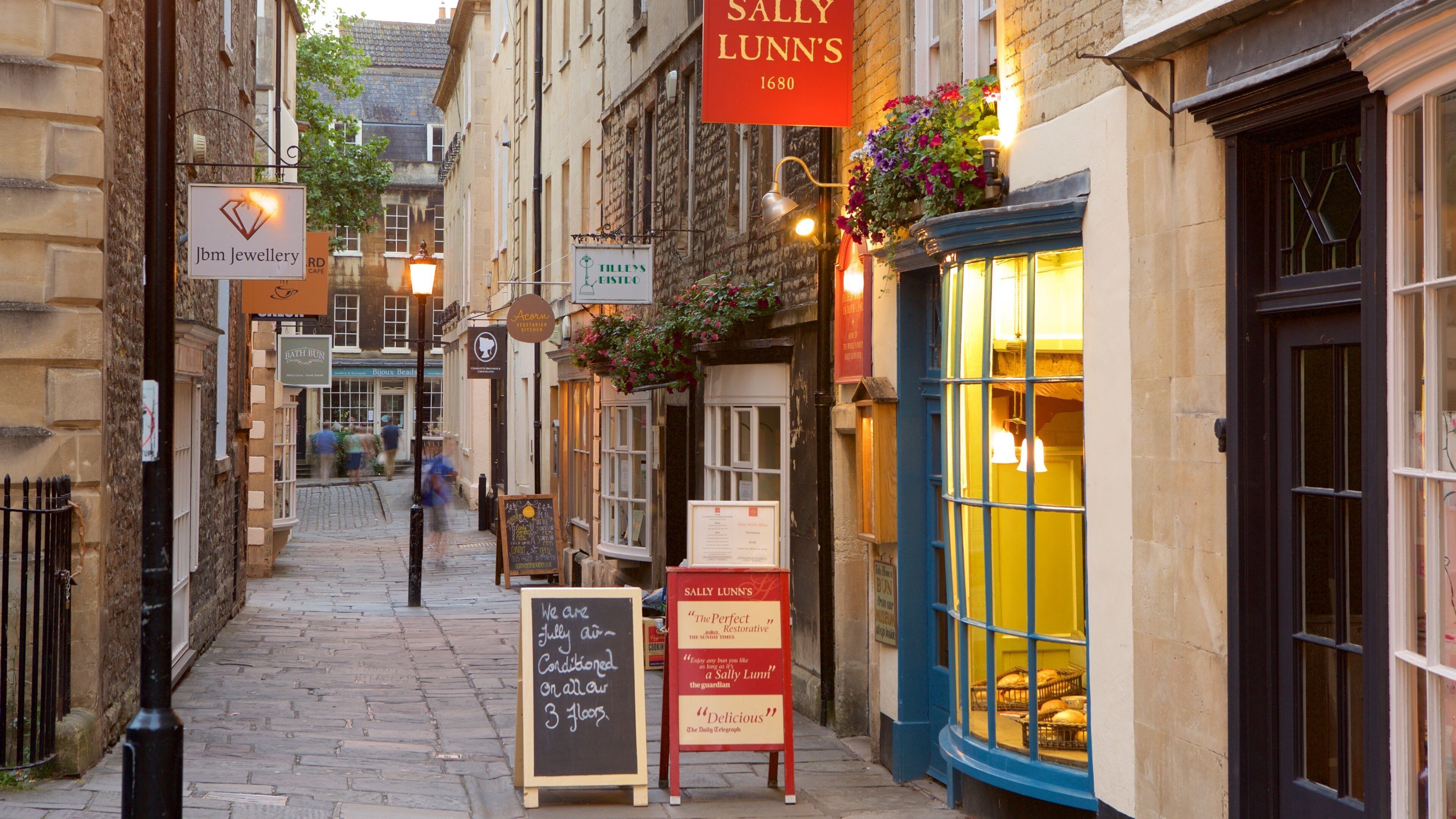 Sally Lunn\'s featuring signage, street scenes and a city