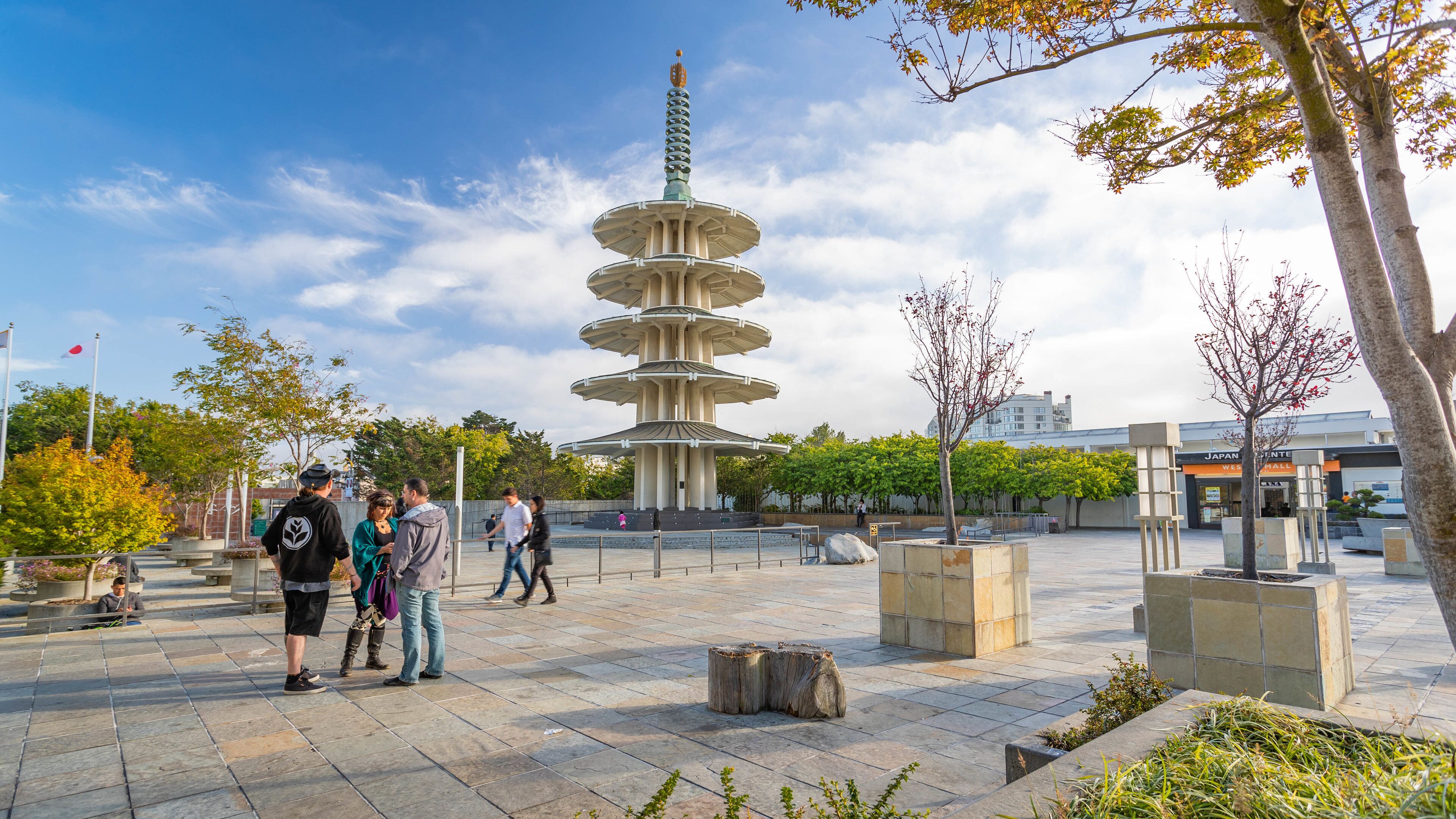Japantown showing street scenes and a square or plaza as well as a small group of people