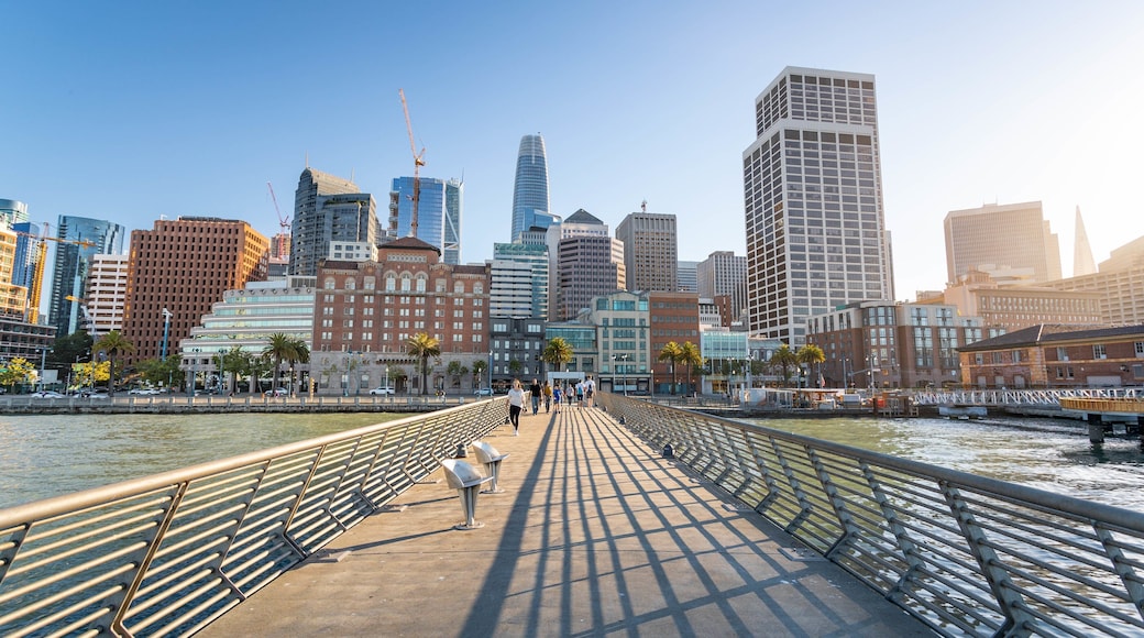 Embarcadero Plaza featuring a bridge, a sunset and a river or creek