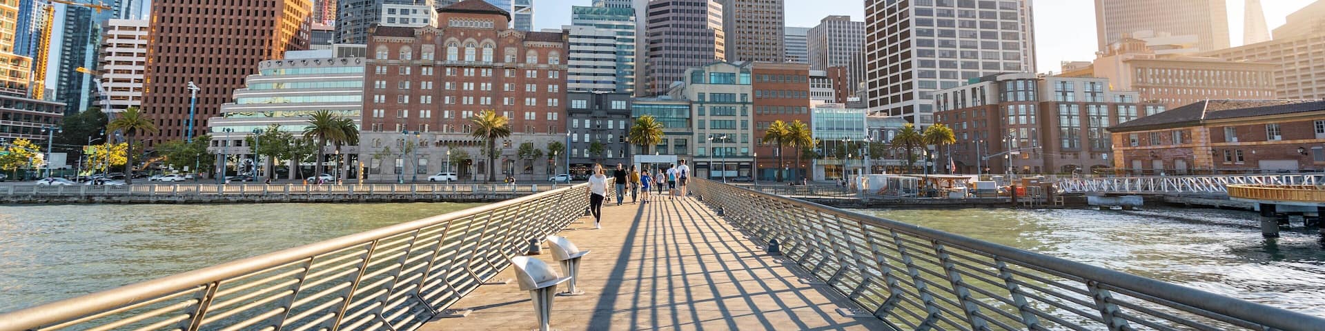 Embarcadero Plaza featuring a bridge, a sunset and a river or creek