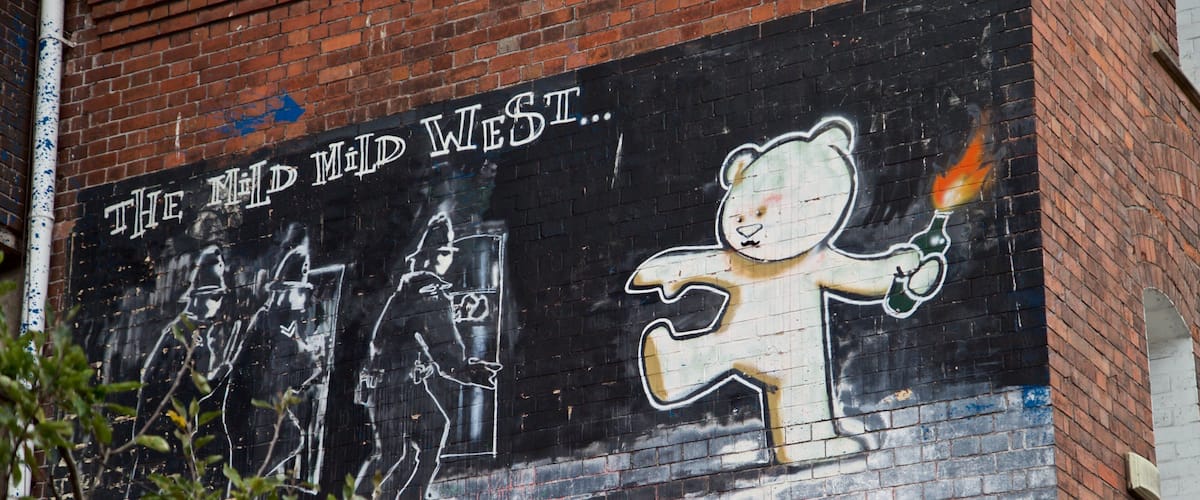 Banksy Graffiti Mild Mild West which includes outdoor art