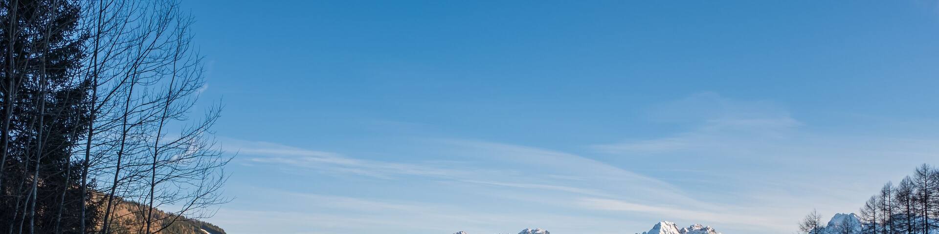Winter landscape with a village Padola in the Dolomite mountains of the Alps, Comelico, Italy, January 2020