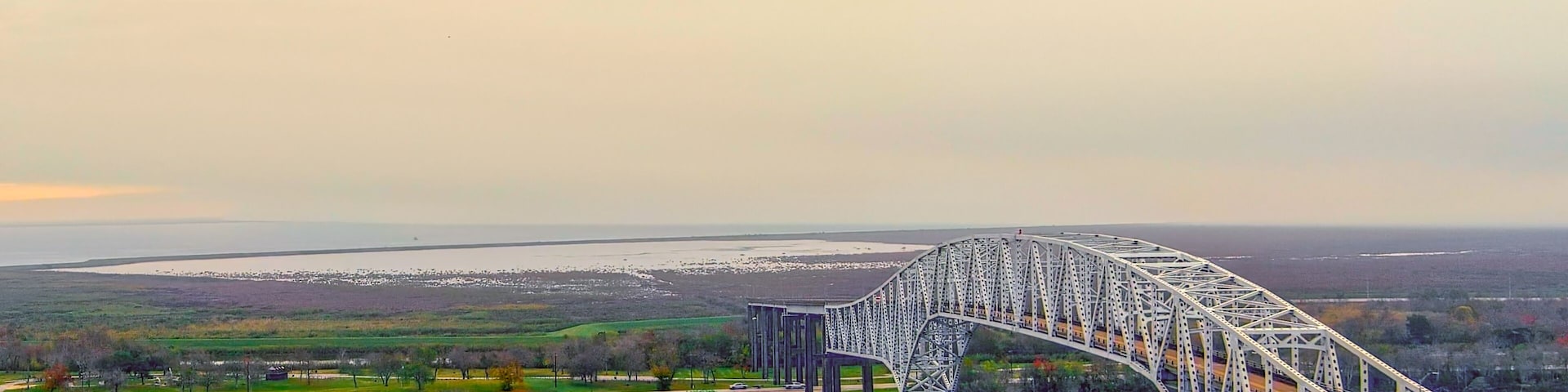 Aerial view of the Sabine Lake Causeway Bridge at Port Arthur Texas on an overcast day.