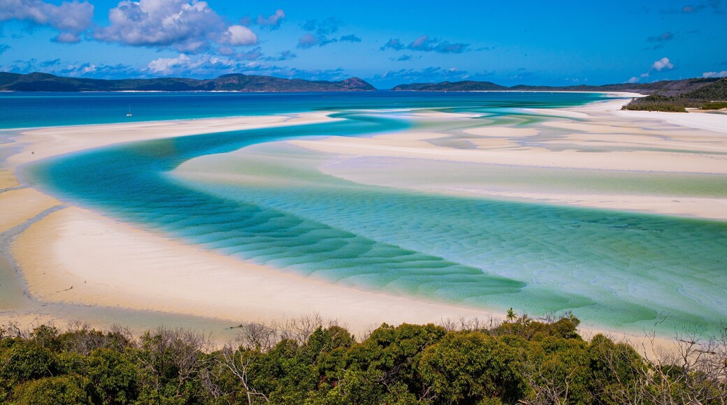 Whitehaven Beach which includes general coastal views, a river or creek and landscape views