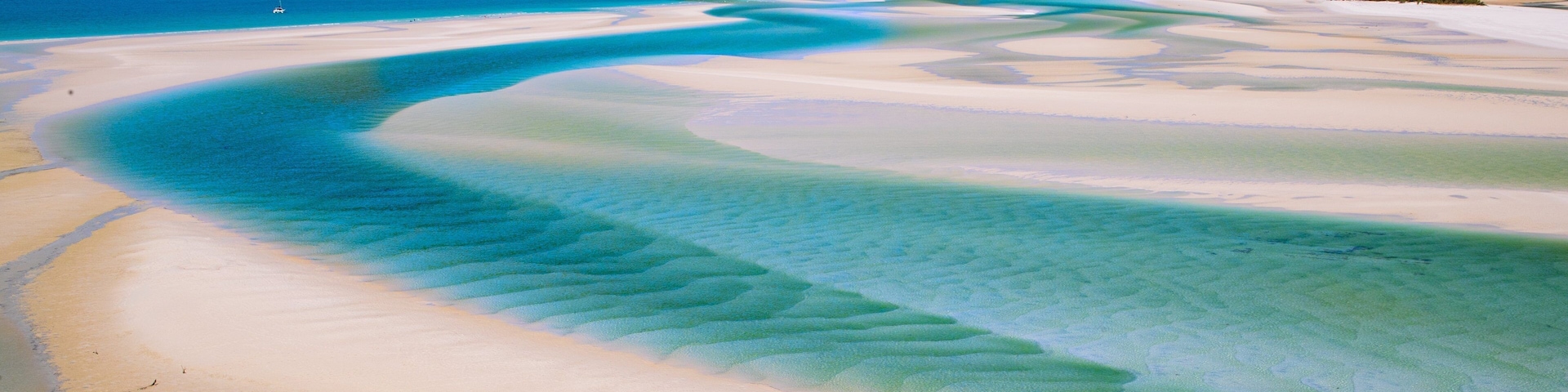 Whitehaven Beach which includes general coastal views, a river or creek and landscape views