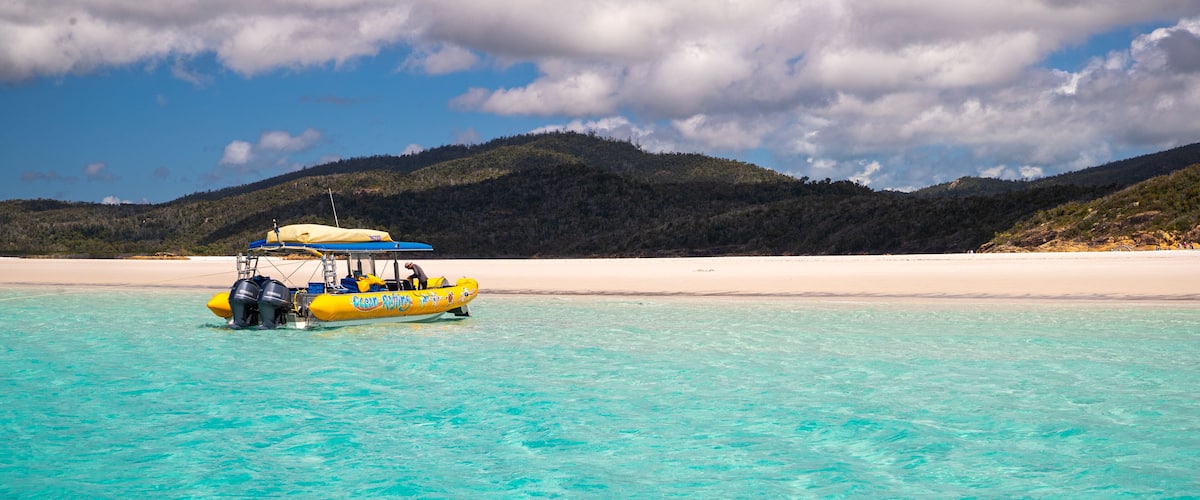 Whitehaven Beach showing general coastal views, boating and tropical scenes