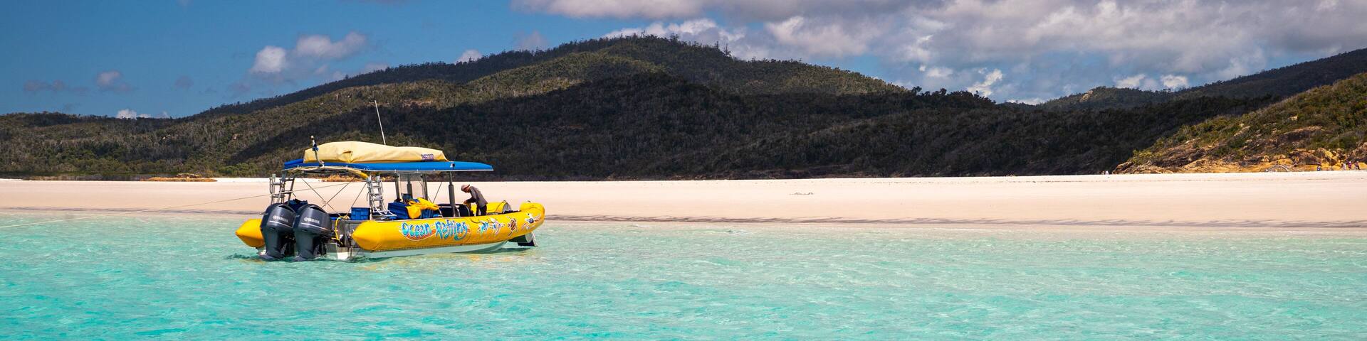 Whitehaven Beach showing general coastal views, boating and tropical scenes