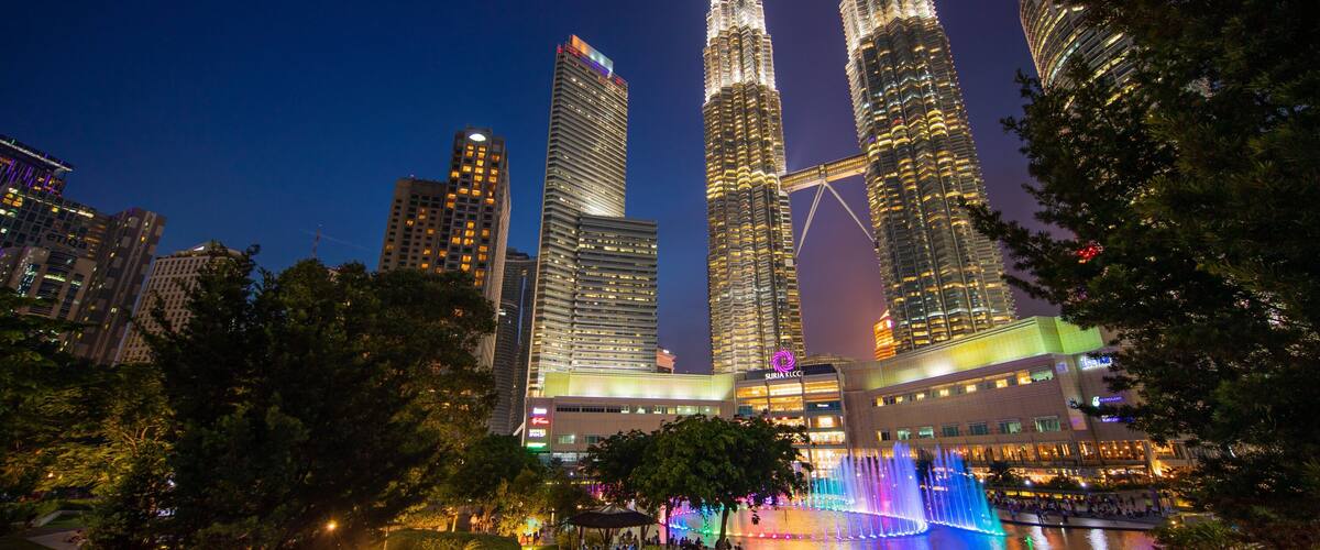 The Petronas Twin Towers in Kuala Lumpur, Malaysia, illuminated at night.