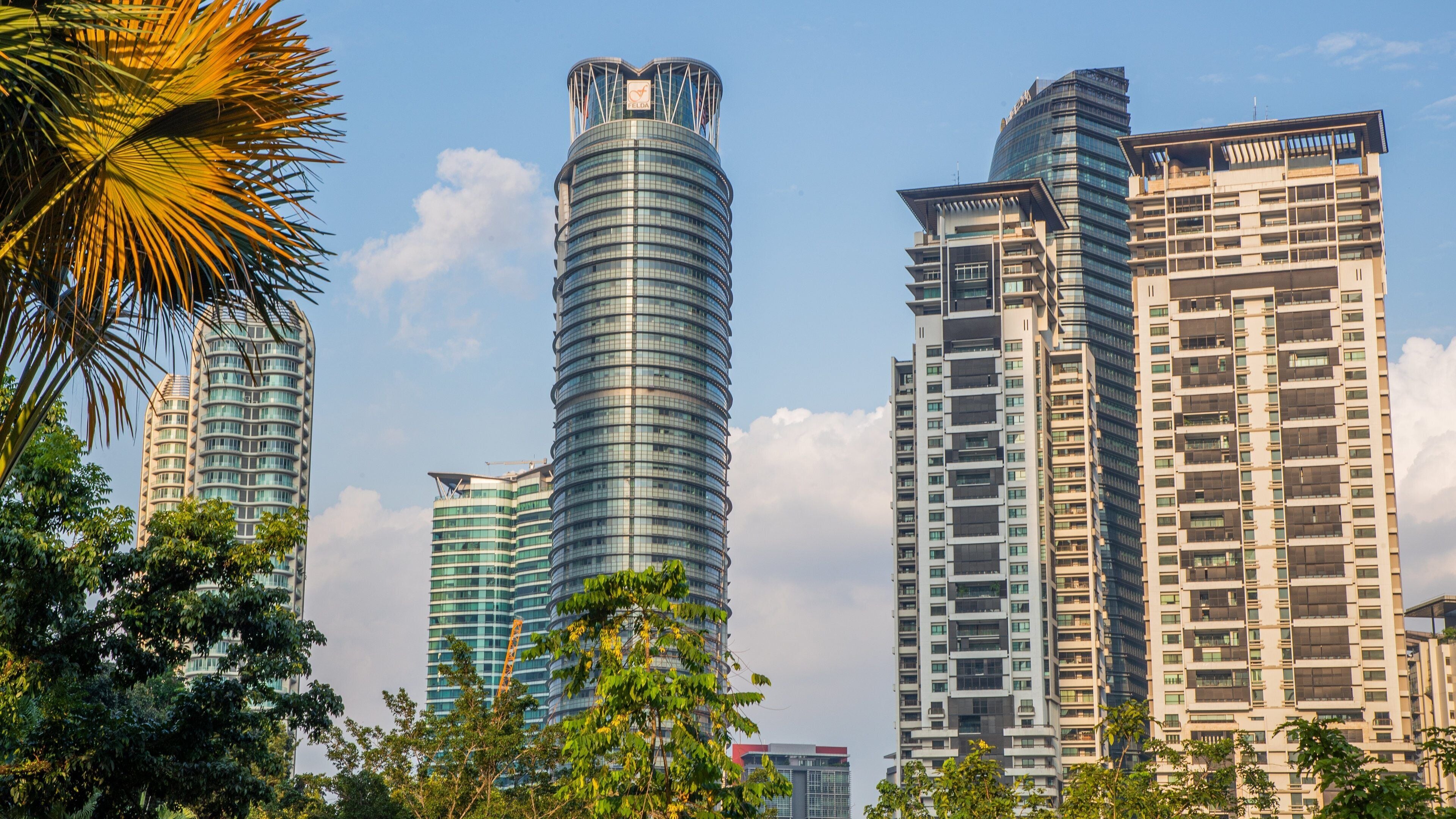 KLCC Park which includes a city and a high rise building